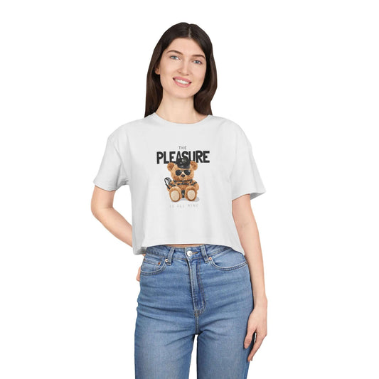 Playful teddy bear graphic crop top featuring bold text 'The Pleasure Is All Mine' for trendy everyday fashion.
