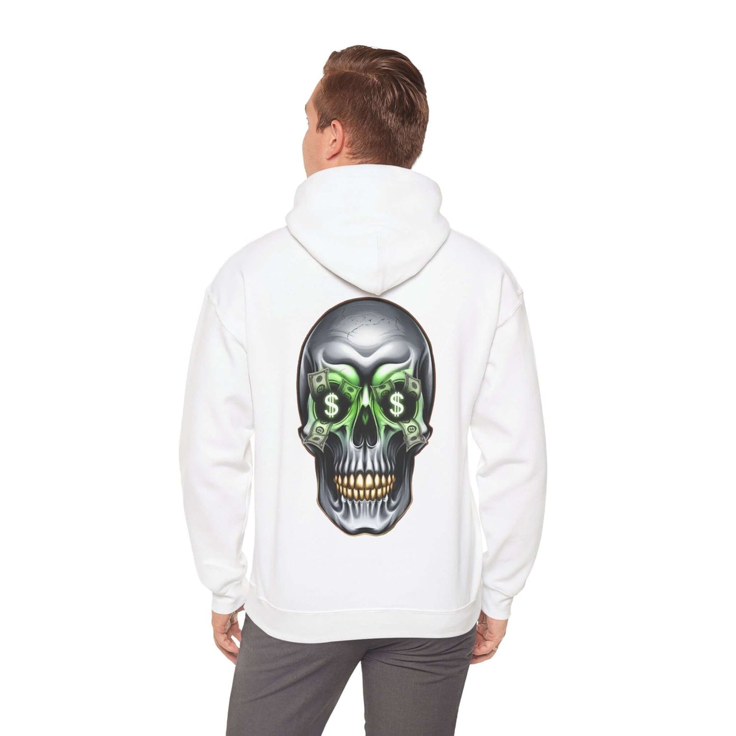 Man wearing a white hoodie featuring a cool skull design with dollar bills in its eye sockets, showcasing an edgy streetwear vibe.