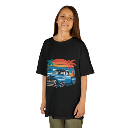 Kids retro T-shirt featuring a vintage pickup truck design with palm trees and sunset vibes.
