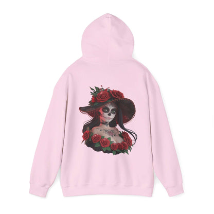 Chibi sugar skull woman hoodie with roses on a pink background, perfect for Halloween and Day of the Dead festivities.
