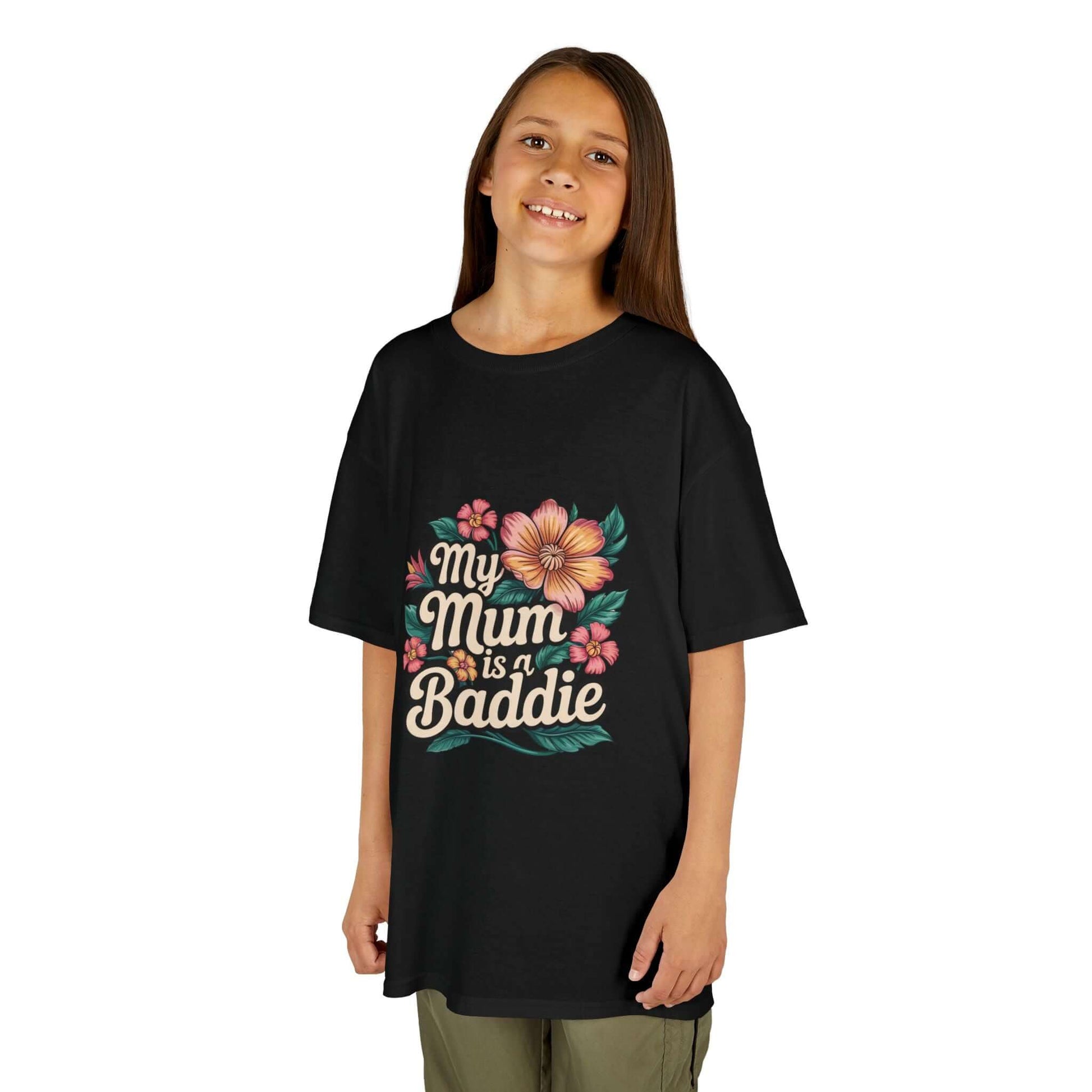 Kid wearing a black tee with tropical flower design stating 'My Mum is a Baddie', perfect for Mother's Day gifts.