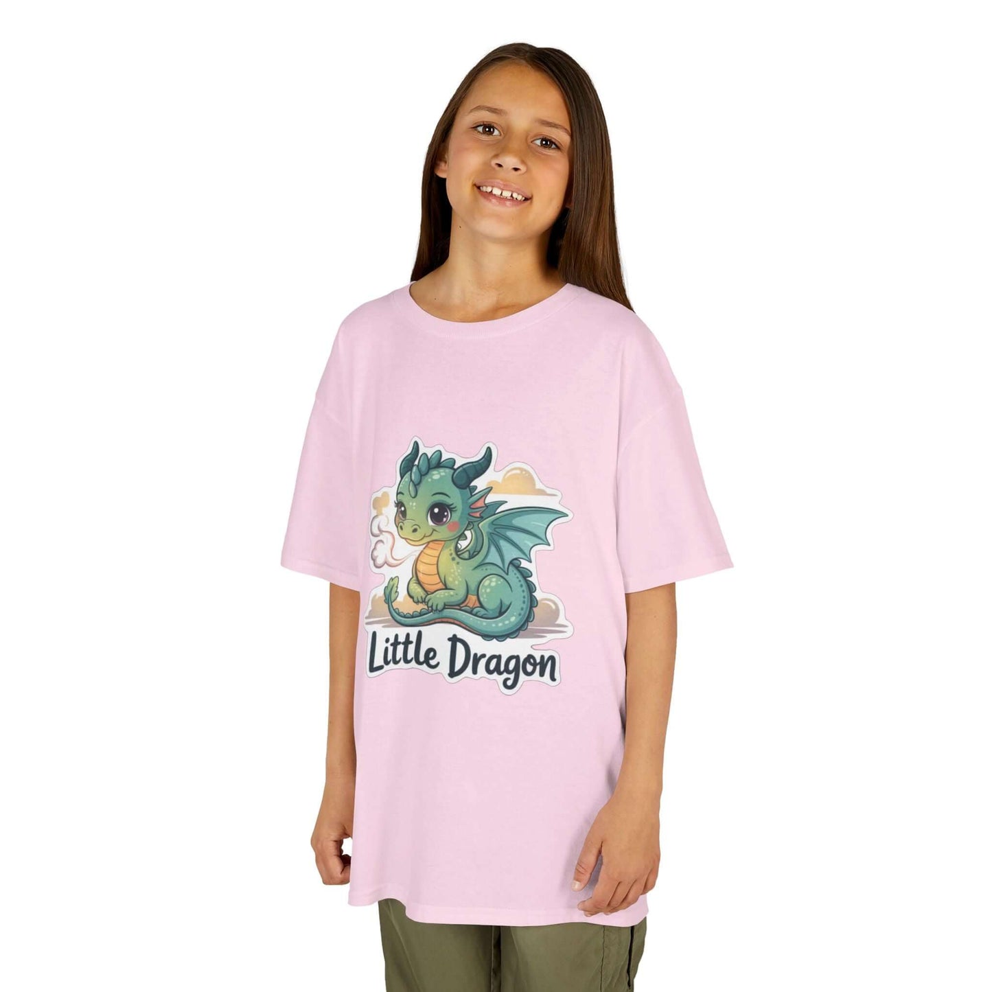 Young girl wearing a pink Kids Tee with 'Little Dragon' cartoon character design, ideal for casual wear.