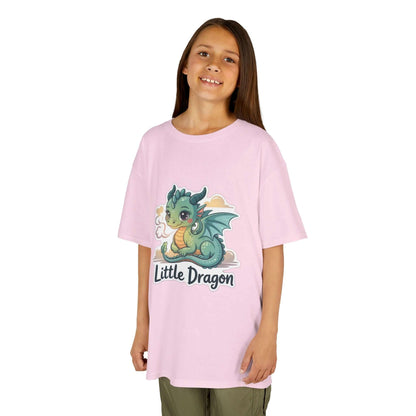 Young girl wearing a pink Kids Tee with 'Little Dragon' cartoon character design, ideal for casual wear.