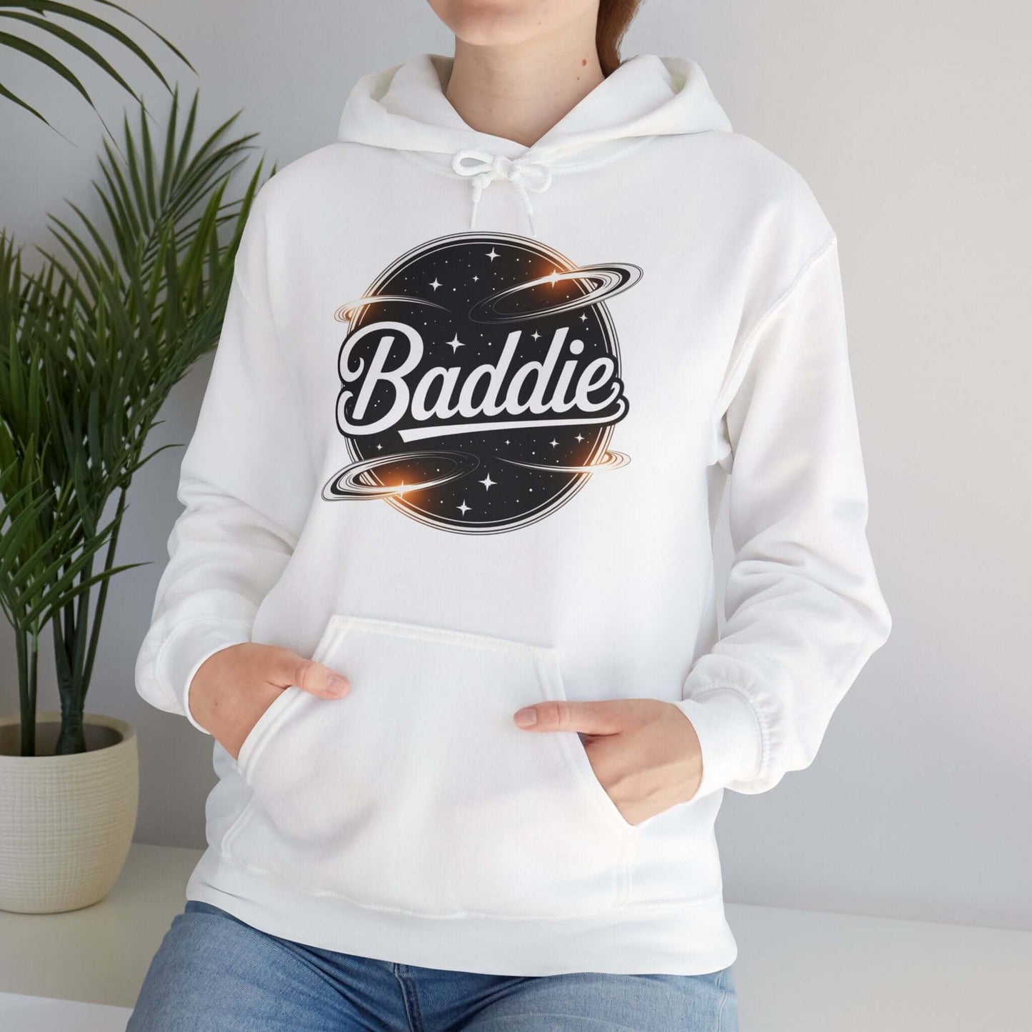 White hooded jumper featuring 'Baddie' universe design with retro vibe, perfect for trendy casual wear.