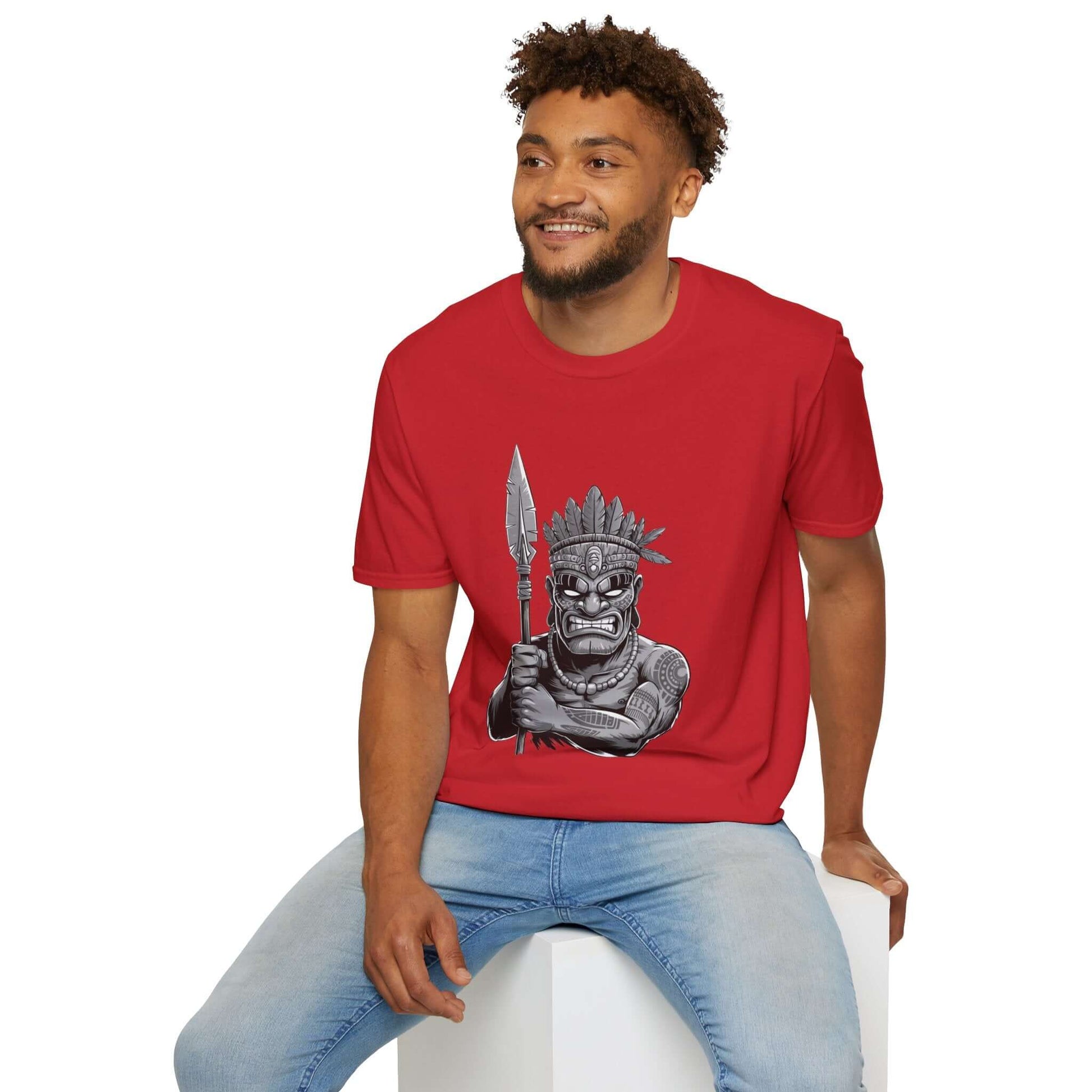 Man wearing a red T-shirt featuring a Tiki character design with a spear, showcasing unique fashion and stylish flair.