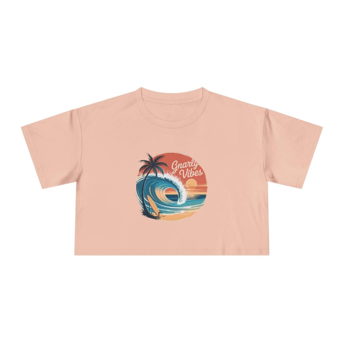 Women's crop top with retro big wave surf design and 'Gnarly Vibes' text on pink fabric, evoking summer beach vibes.