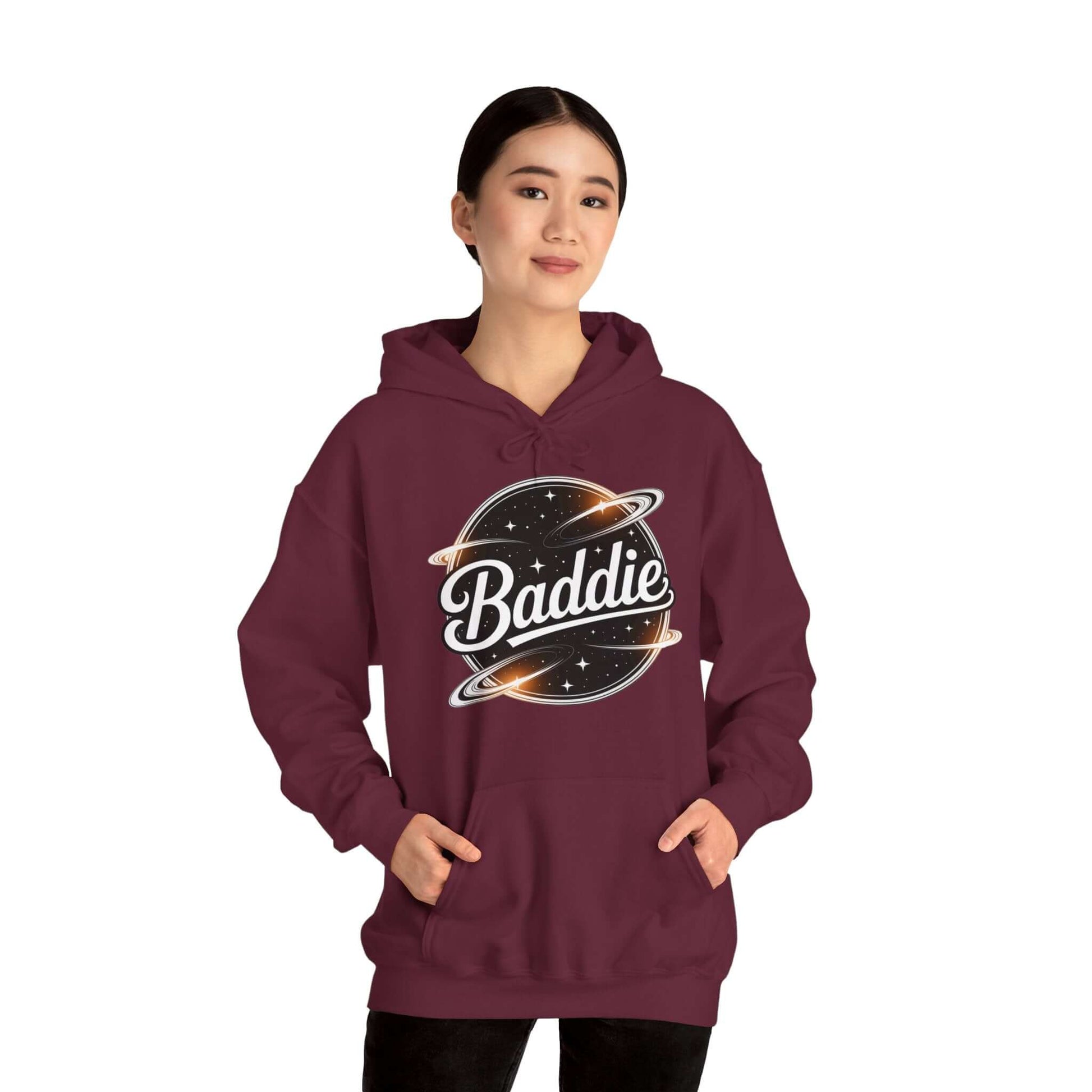 Trendy maroon hoodie featuring 'Baddie' universe design with retro vibe and spacious kangaroo pocket.