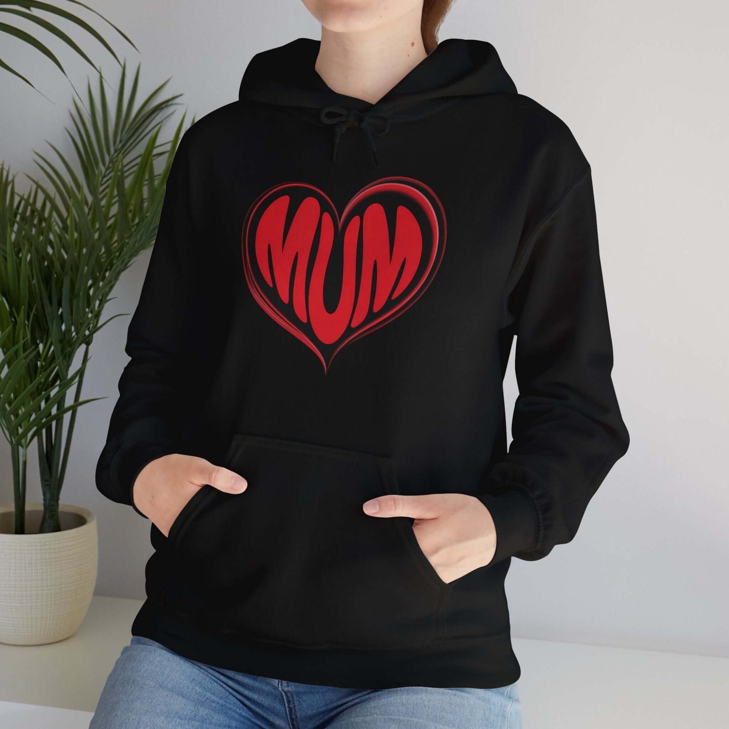 Hooded sweatshirt featuring red 'MUM' heart design on black, perfect for Mother's Day celebrations.