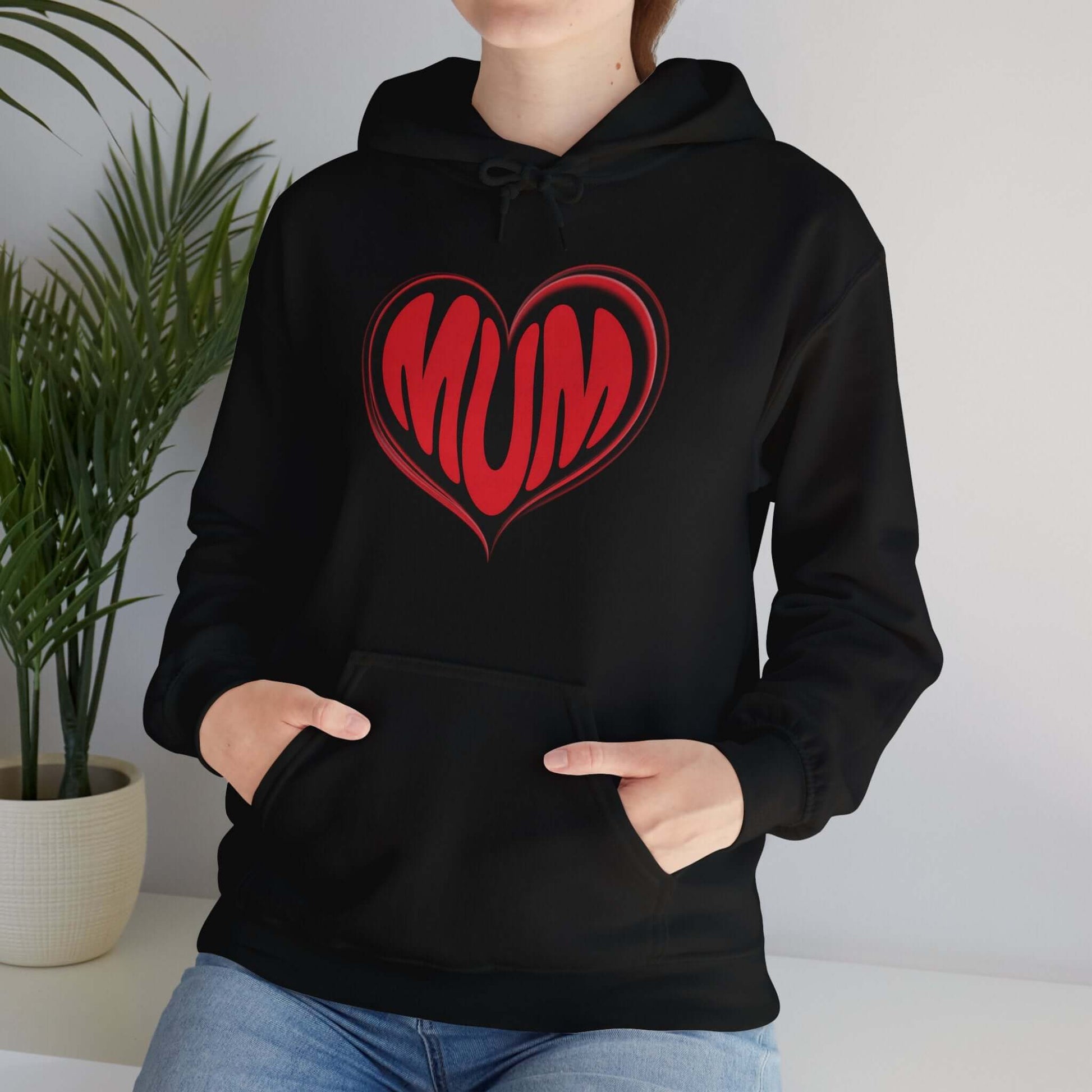 Hooded sweatshirt featuring red 'MUM' heart design on black, perfect for Mother's Day celebrations.