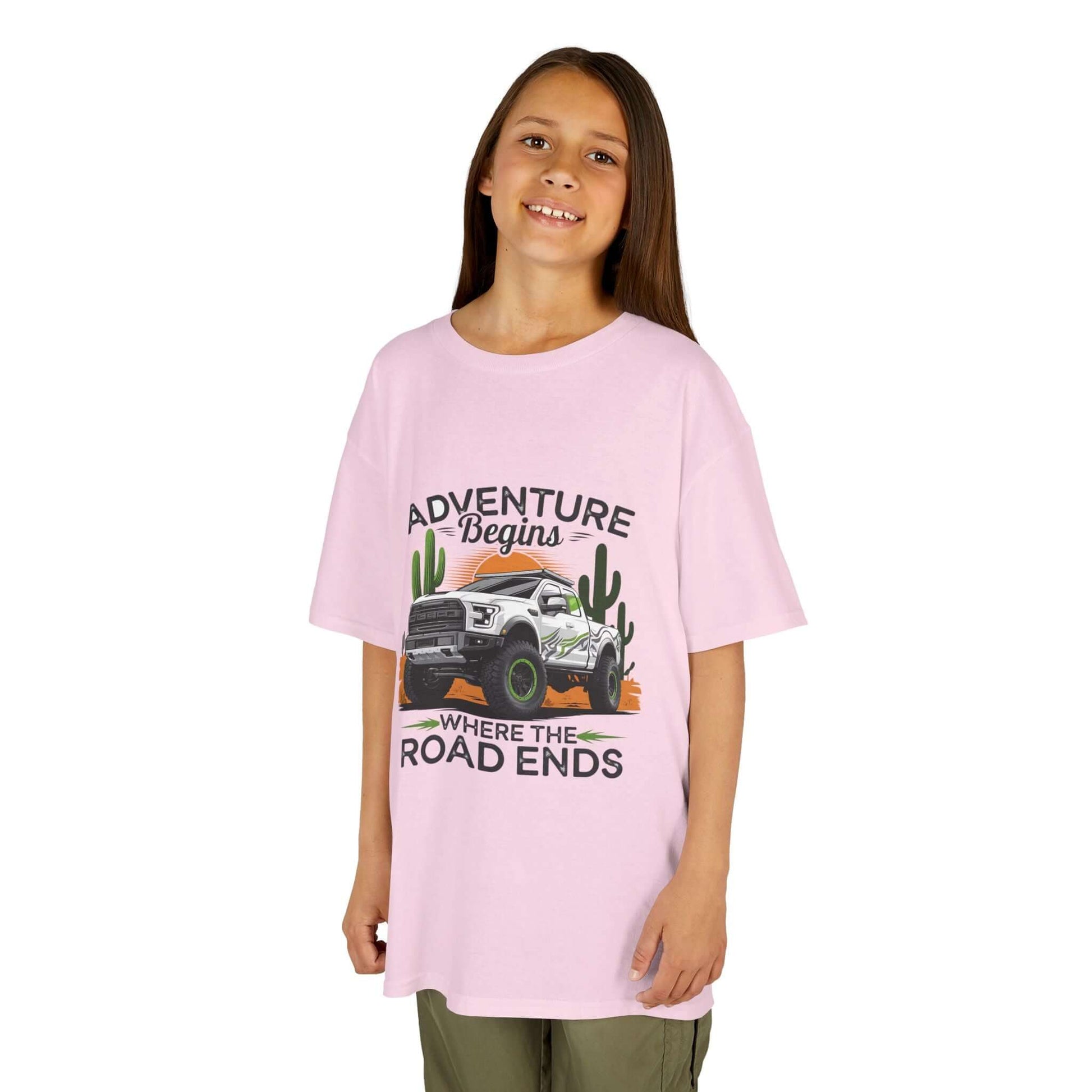 Kids t-shirt featuring off road truck, sunset desert design, and text 'Adventure begins where the road ends' for outdoor enthusiasts.