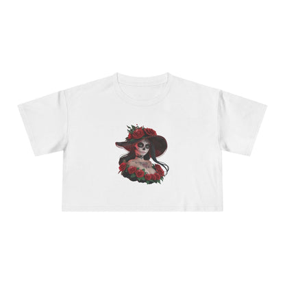 Chibi woman with sugar skull makeup and roses on a white crop top, perfect for Halloween and Day of the Dead festivities.