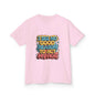 Kids tee with colorful graffiti design and funny quote 'I see no good reason to act my age', perfect for playful style.