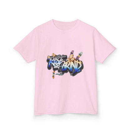 Kid's T-shirt in light pink with graffiti 'Rise and Grind' design, featuring skateboards and urban style.