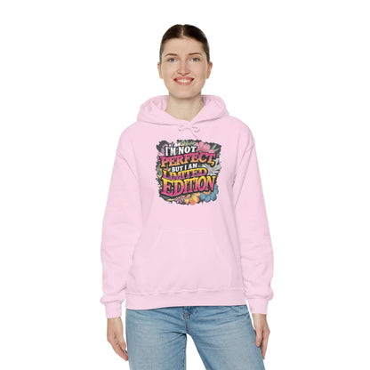 Cozy pink hoodie featuring colorful floral design and quote "I'm not perfect, but I am limited edition".