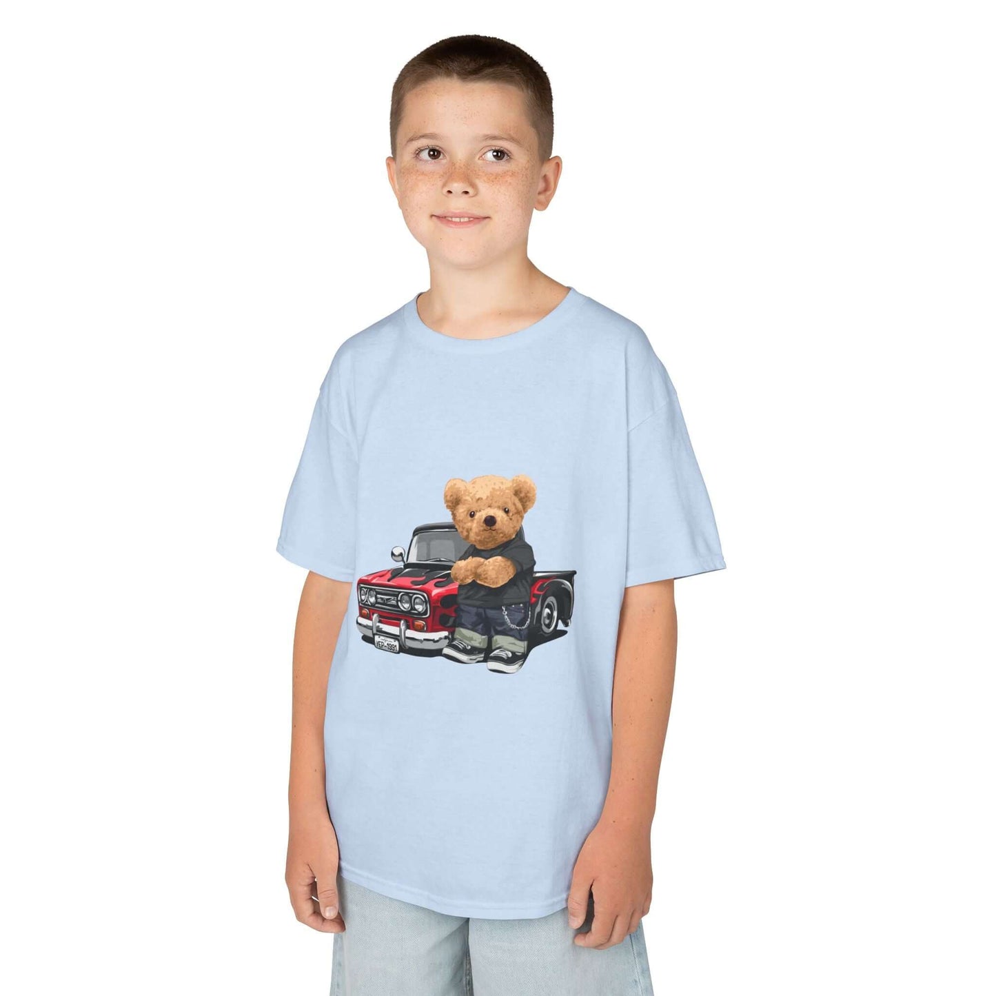 Light blue kid's t-shirt featuring a cute teddy bear with a vintage pickup truck design, perfect for car lovers.