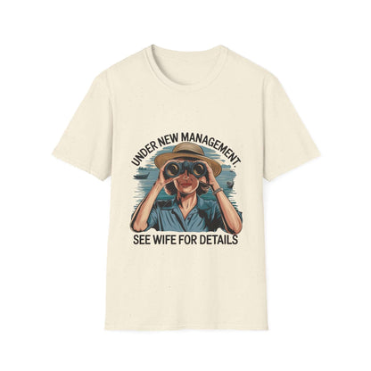 Retro unisex T-shirt with 'Under New Management' design, featuring a woman with binoculars and a humorous touch.