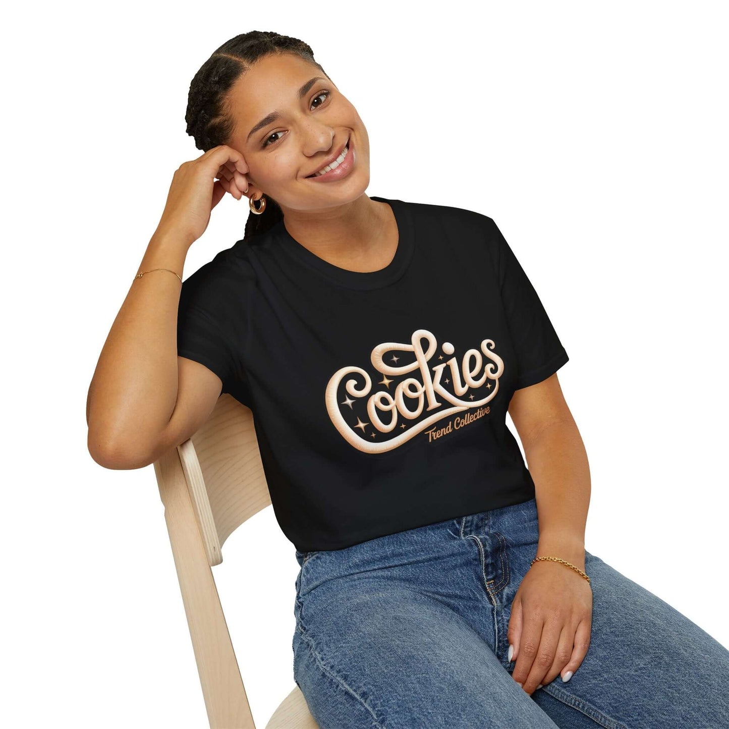 Model wearing a black 'Cookies Trend Collective' T-Shirt with cursive writing, showcasing a trendy casual style.