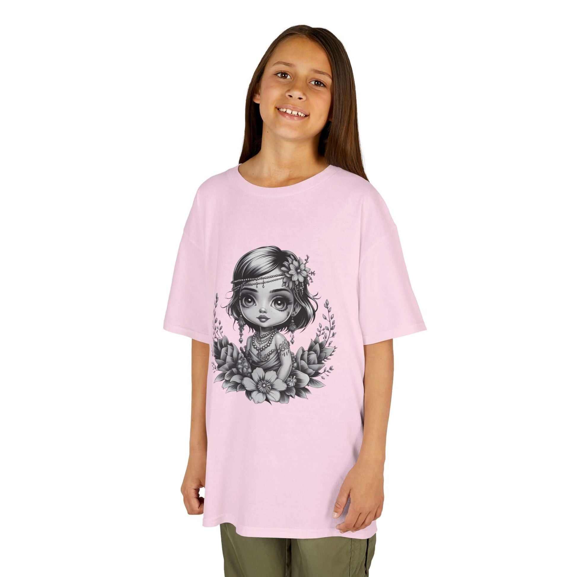 Black and white chibi-style illustration of a girl with jewelry and flowers on a pink kids tee, showcasing a cute playful vibe.