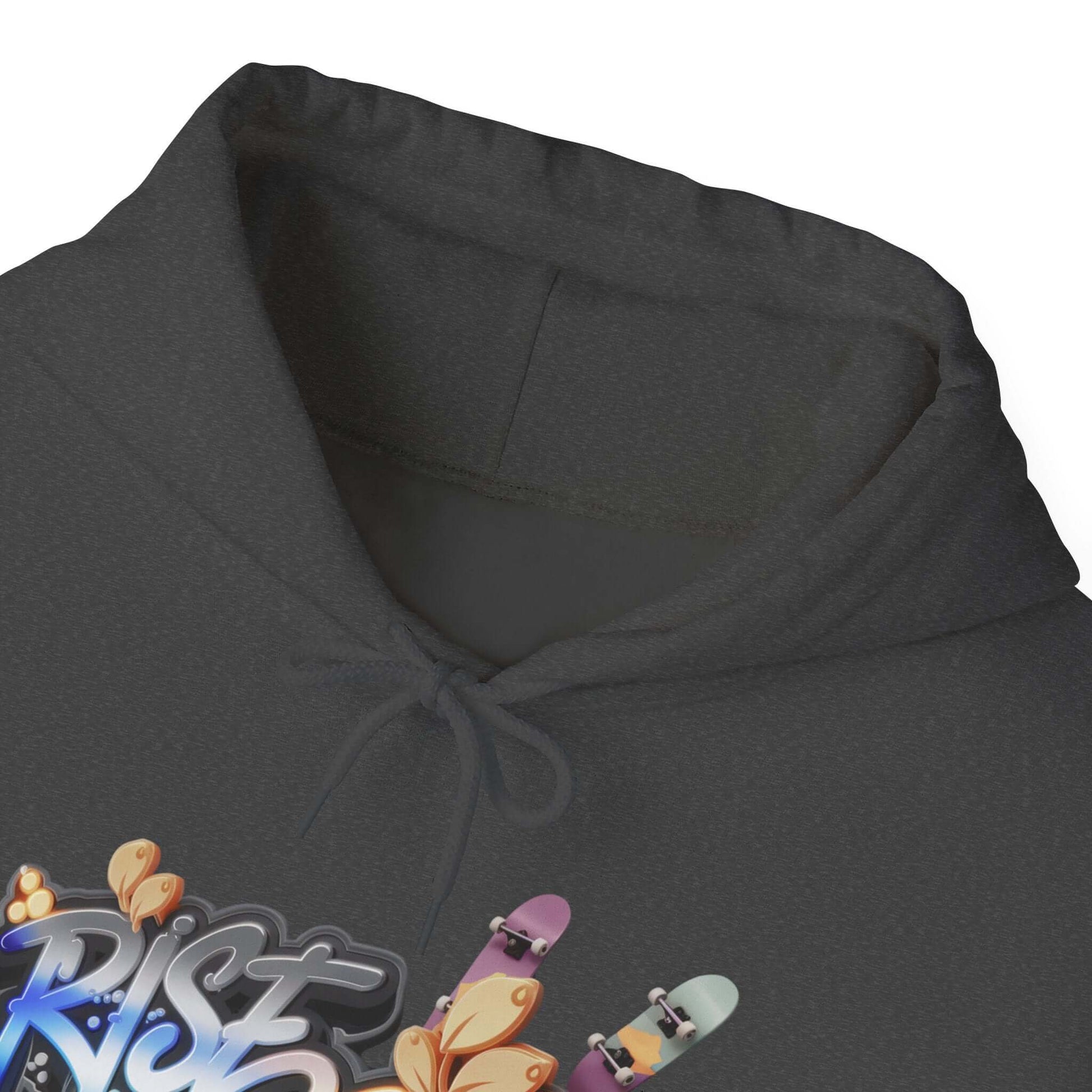 Close-up of hoodie featuring 'Rise and Grind' graffiti design with skateboards and coffee leaves, perfect for streetwear.