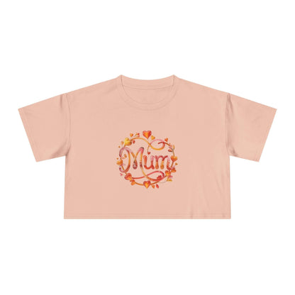 Stylish pale pink women's crop top with 'Mum' design featuring translucent flower and heart accents, perfect for Mother's Day.