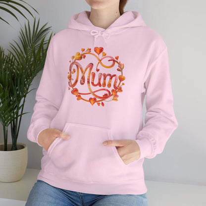 Stylish pink hoodie with 'Mum' design featuring translucent flower and heart accents, perfect for Mother's Day.