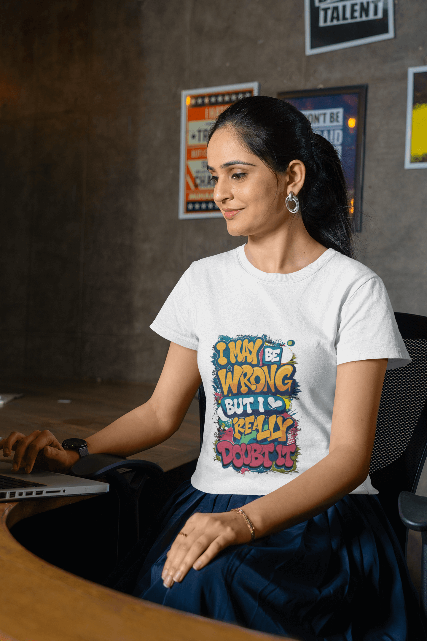 Woman in a colorful typography T-shirt with the quote 'I may be wrong, but I really doubt it', exuding humor and casual style.