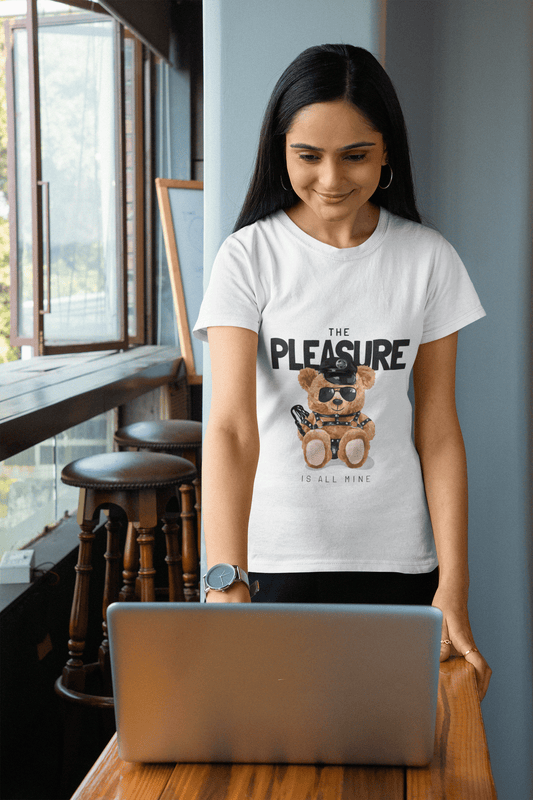 Woman wearing a playful T-Shirt featuring a teddy bear and the phrase "The PLEASURE is all mine."