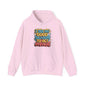 Hooded sweatshirt with colorful quote 'I see no good reason to act my age' on a pink background.