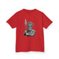 Kids red tee with black and white Tiki character design holding spear, perfect for trendy children's fashion.