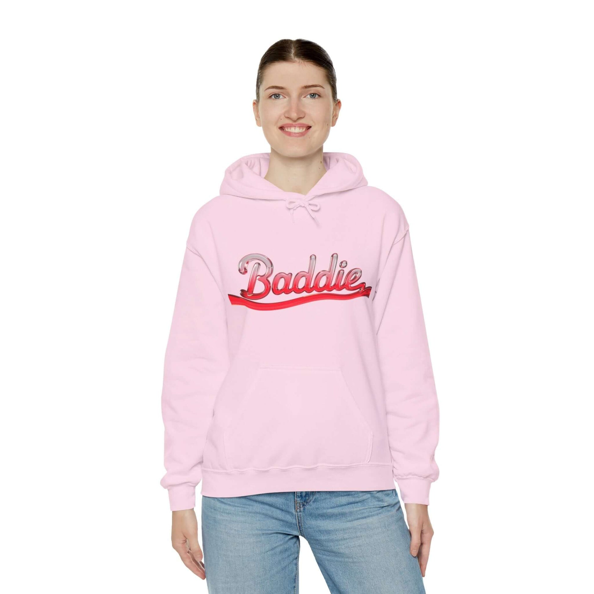 Pink hooded sweatshirt with trendy 'Baddie' typography design in red liquid-like text, perfect for streetwear style.