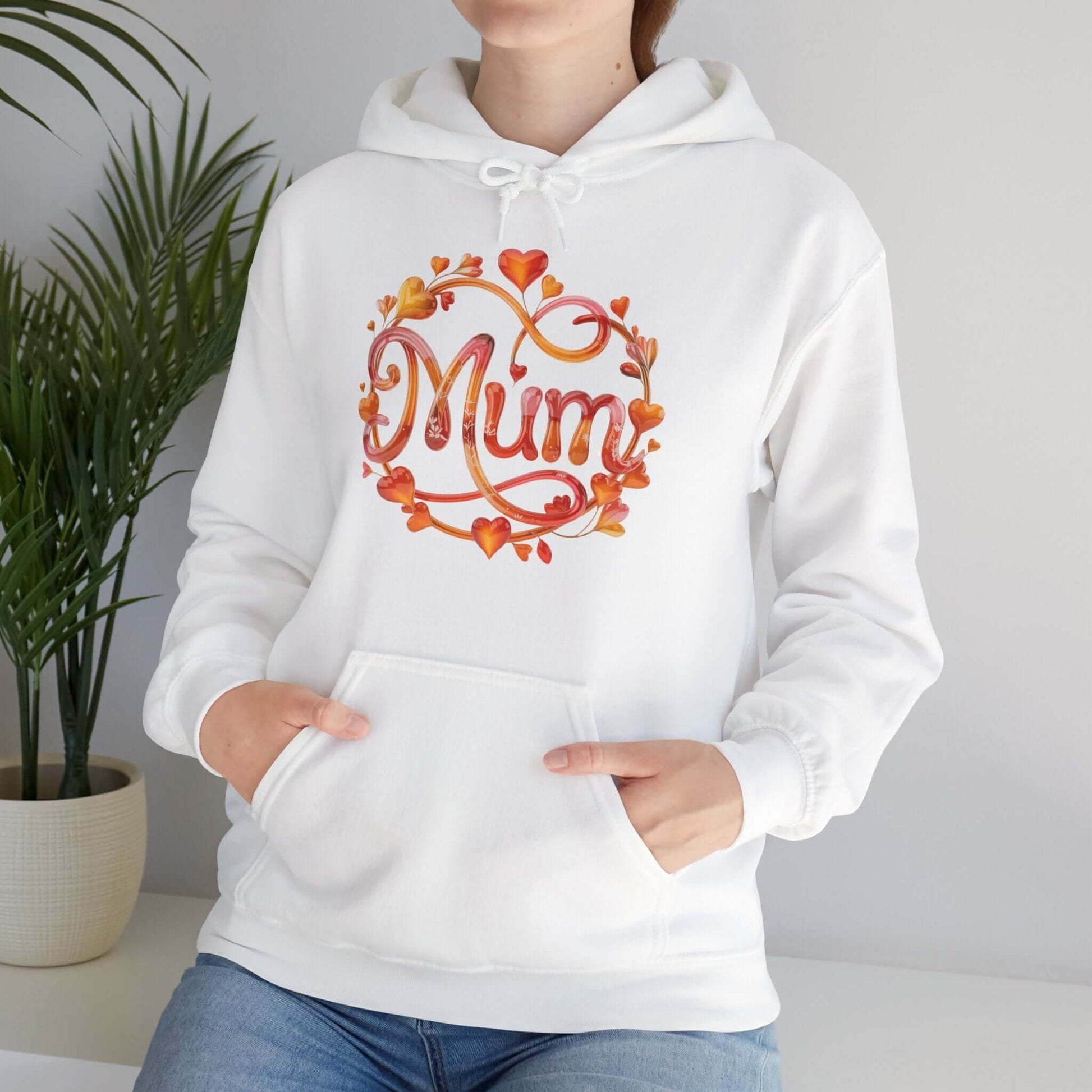 Cozy white hoodie with 'Mum' design in shimmering colors, adorned with floral and heart details, perfect for Mother's Day.