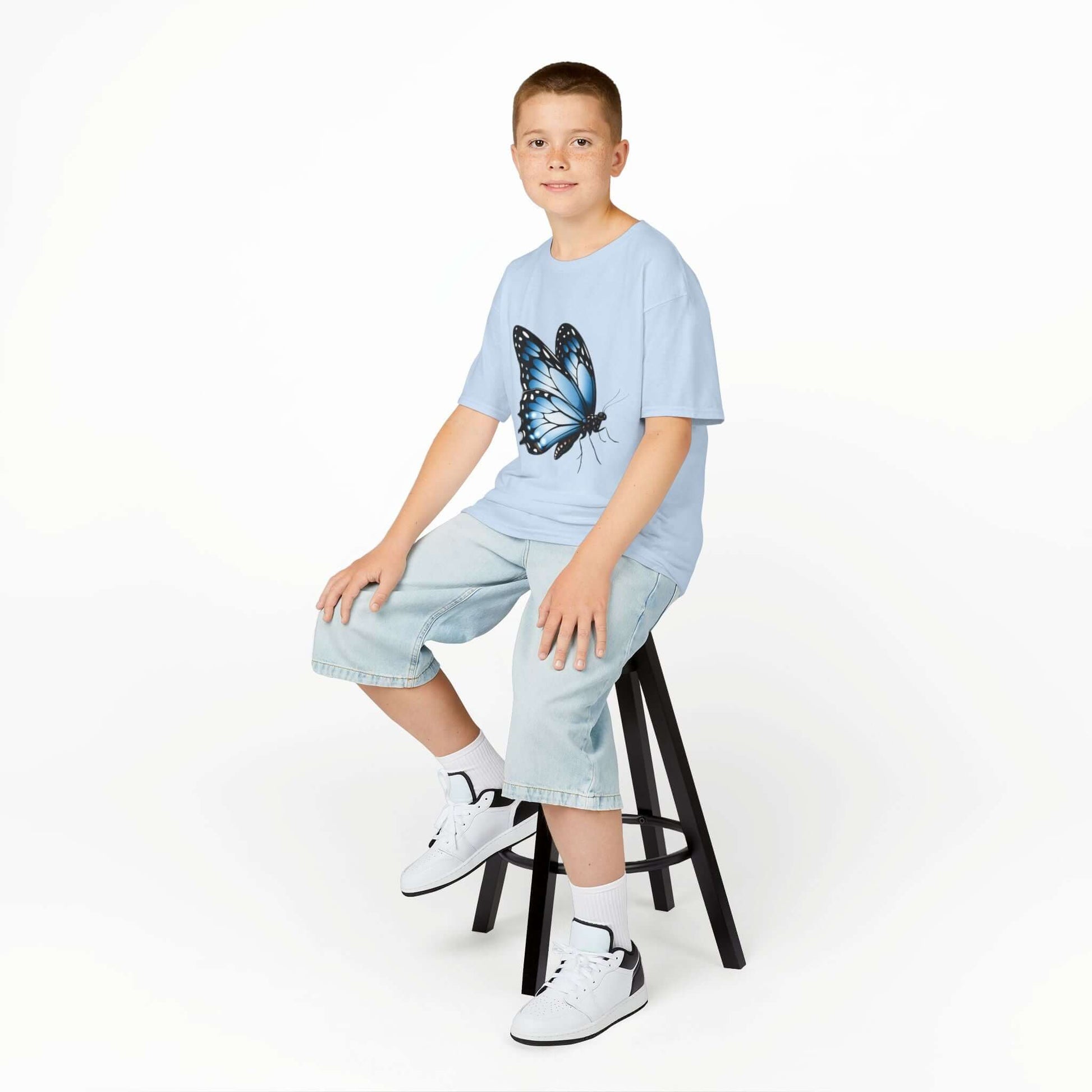 Blue kid's T-shirt featuring a beautiful blue butterfly design, perfect for nature and animal lovers.
