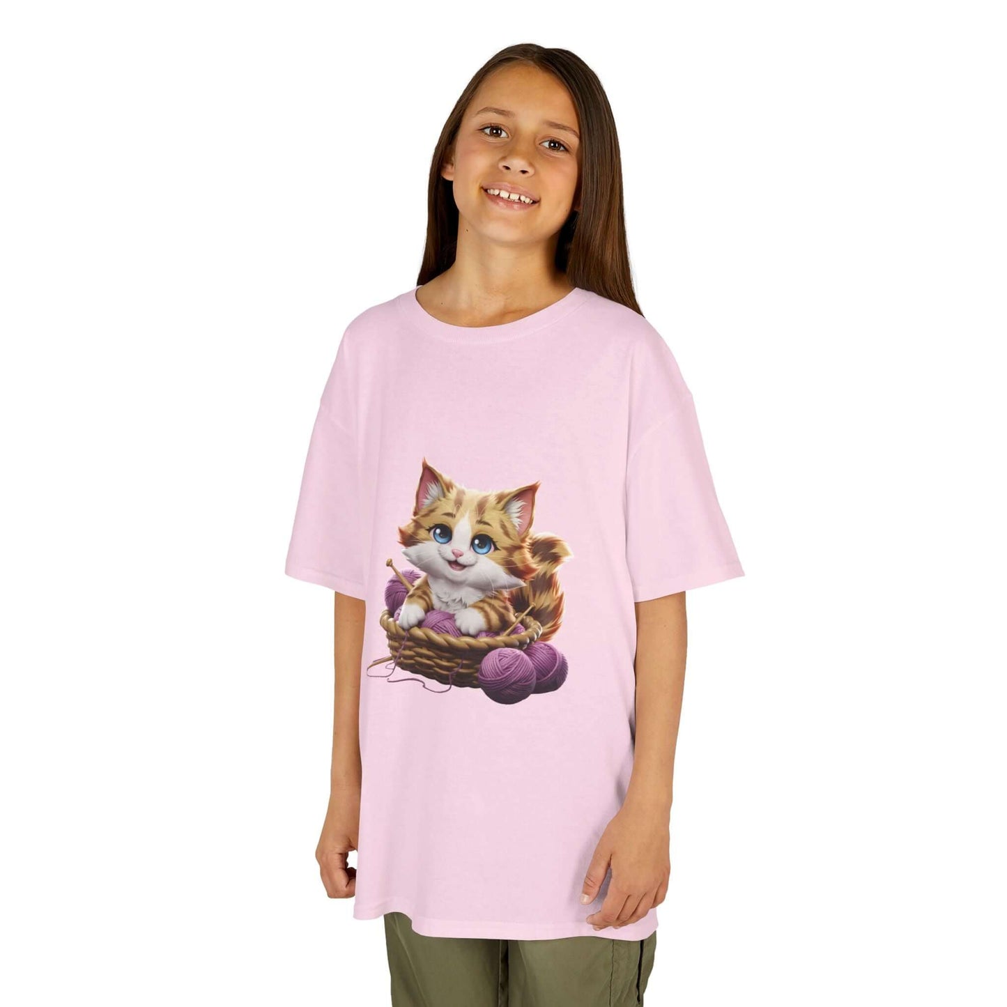 Pink Kid's Tee featuring a cute cat playing in a basket of wool, perfect for cat lovers and kid's fashion.