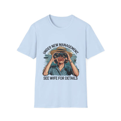 Retro unisex T-shirt with 'Under new management, see wife for details' graphic, featuring a woman in a hat using binoculars.