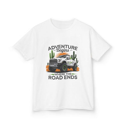Kids T-Shirt featuring an off road truck with sunset desert design and text 'Adventure begins where the road ends'.