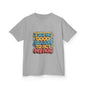 Kids t-shirt in gray featuring colorful graffiti style design with the quote 'I see no good reason to act my age'.