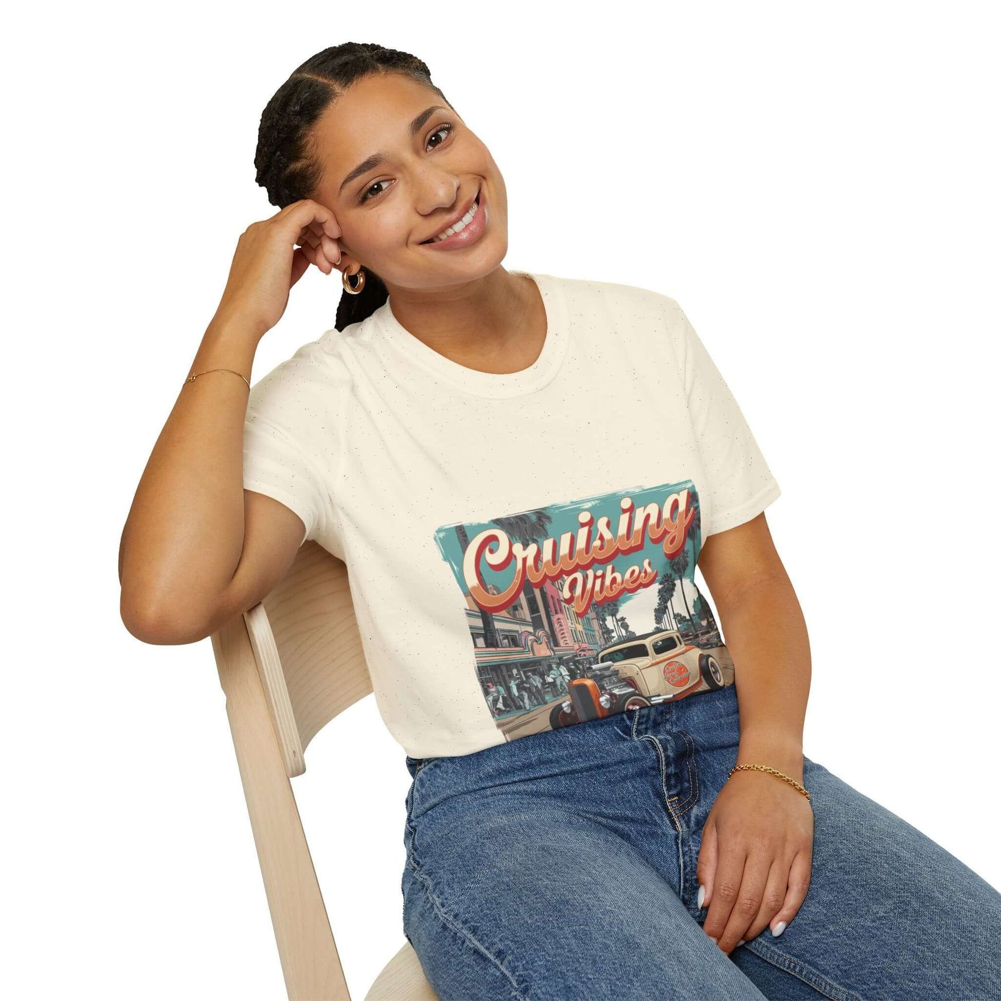 Model wearing vintage hotrod 'Cruising Vibes' T-shirt featuring palm tree lined street design.