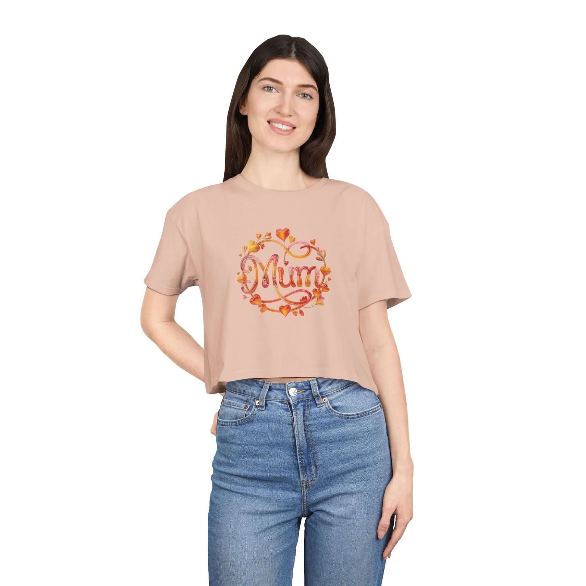 Cute pale pink women's crop tee featuring shimmering 'Mum' design with floral and heart ornate, perfect for Mother's Day.
