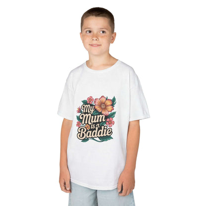 Kid wearing a white tee with tropical flower design and text 'My Mum is a Baddie', perfect for Mother's Day.
