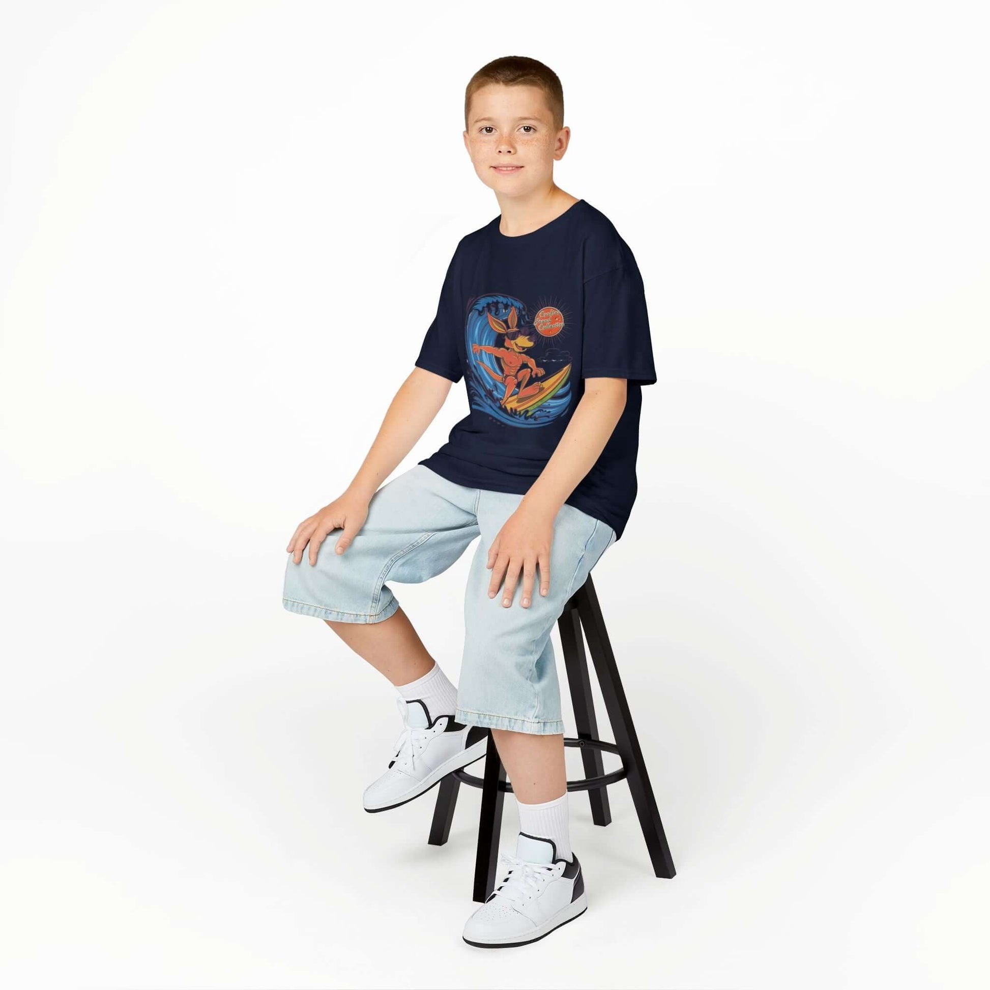 Kid's T-shirt with cool kangaroo surfing a wave design, ideal for beach lovers and summer vibes.
